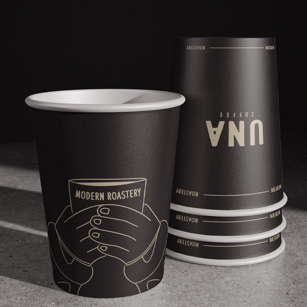 UNA Coffee black takeaway cups with illustrated branding